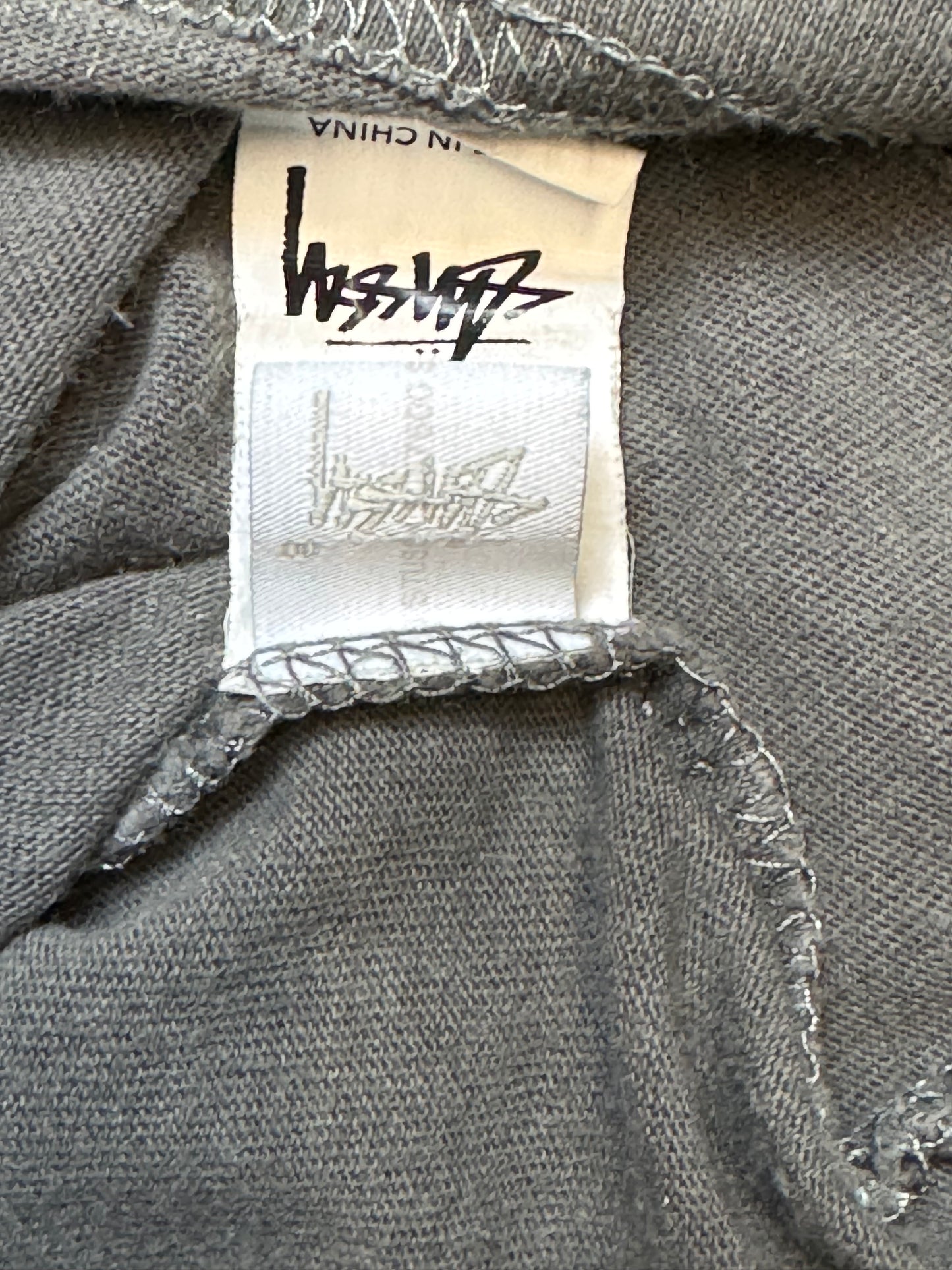 STÜSSY “World Tour” T-Shirt – Grey
